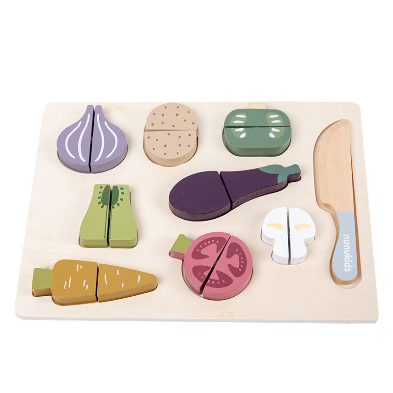 Set of wooden toy vegetables and a knife on a white background