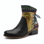 Black ankle boot with colorful patterned top on a white background