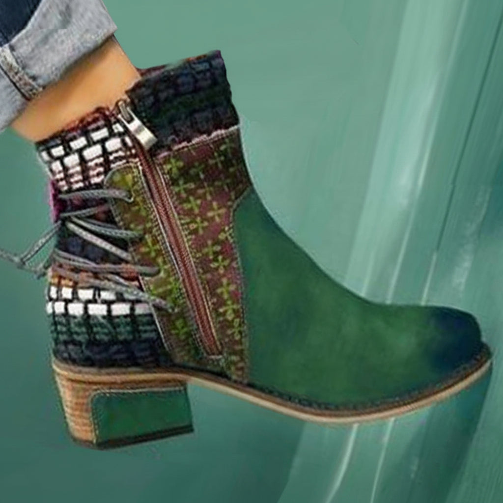 Green ankle boot with patterned side panel on a teal background