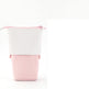 Two-toned pouch with white top and pink bottom on a white background