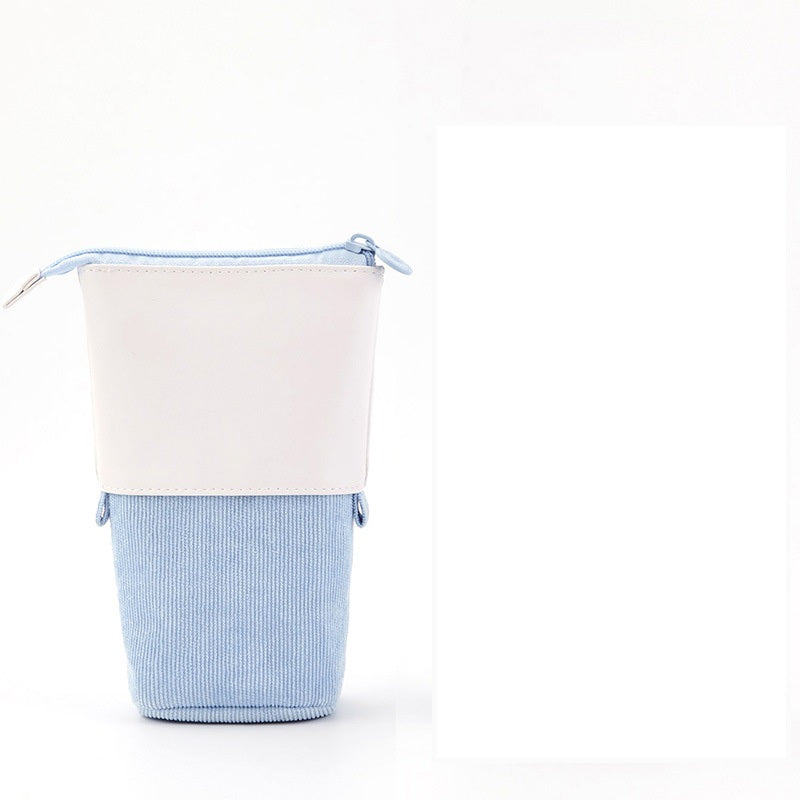 Two-toned fabric pouch with white top and blue striped bottom on a white background