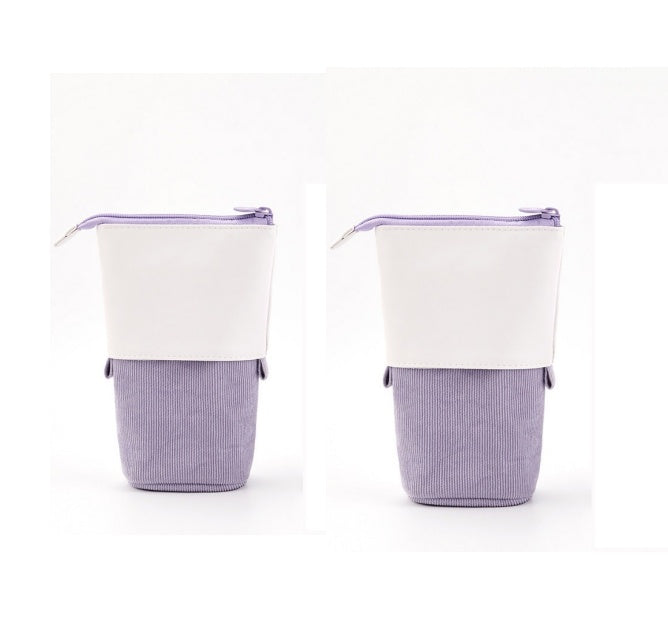 Two purple and white fabric containers with zippers on a white background