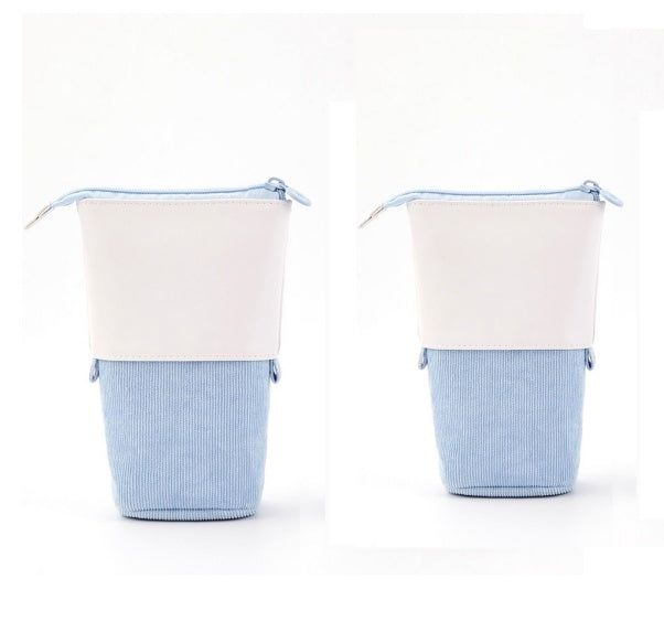 Two fabric baskets with white tops and blue bodies on a white background