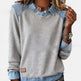 Gray sweatshirt with denim collar and cuffs worn by a person
