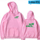 Pink hoodie with 'self care.' text on front and back, displayed from front and back views.