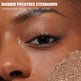 Close-up of eye with glittery eyeshadow labeled 'Mashed Potatoes Eyeshadow' in champagne gold.