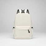 White backpack with black straps on a white background
