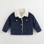 Navy blue corduroy jacket with white sherpa lining on a light gray background