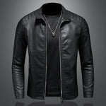 Black leather jacket on a gray background