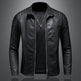 Black leather jacket on a gray background