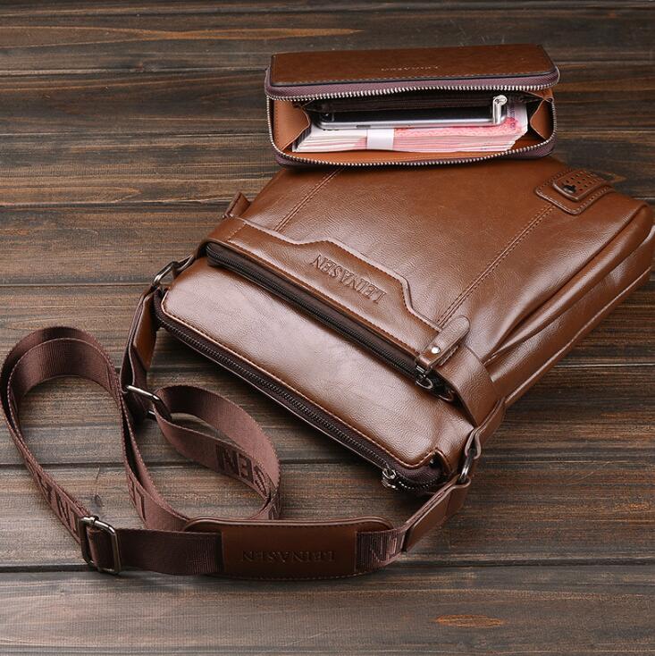Brown leather bag with a smaller pouch on a wooden surface