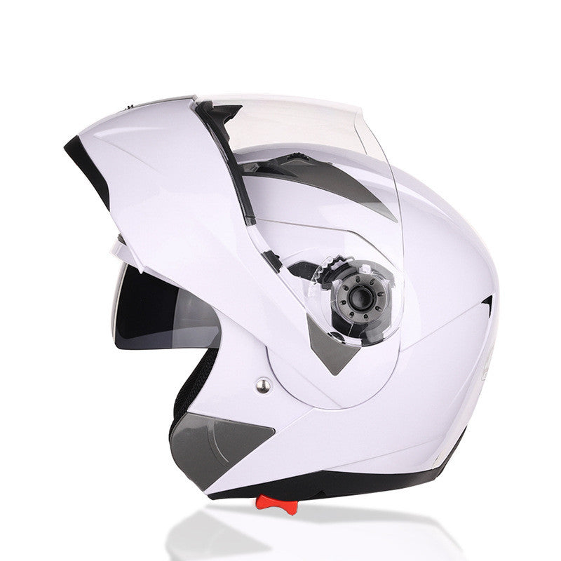 White motorcycle helmet with a clear visor on a white background