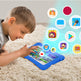 Child playing with a tablet on a carpeted floor with app icons displayed.