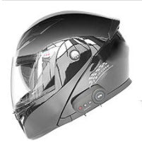 Black motorcycle helmet with visor on a white background