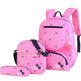 Pink polka dot backpack set with matching pouch on a white background