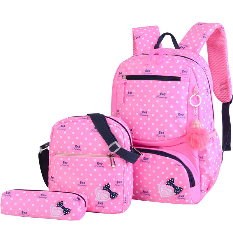 Pink polka dot backpack set with matching pouch on a white background