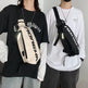 Two people wearing crossbody bags with visible branding against a neutral background