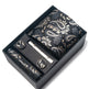 Set of cufflinks and tie clip in a decorative box with paisley pattern