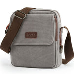Gray shoulder bag with brown strap and visible brand logo on a white background
