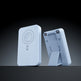 A light blue portable power bank shown from two angles: one front view with a circular magnetic charging area and a small logo, and one side view showing its fold-out stand and connector ports, set against a dark gradient background.