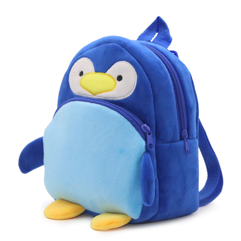 Blue penguin-shaped backpack on a white background