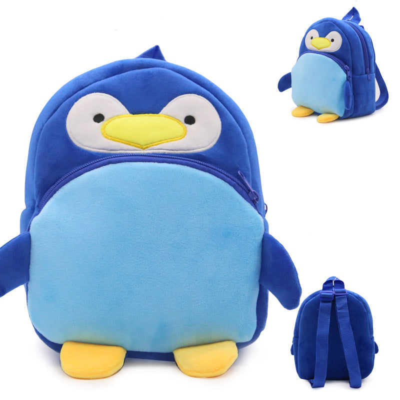 Blue penguin-shaped backpack with yellow feet and beak on a white background