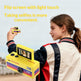 Girl holding a yellow retro-style camera with a flip screen, outdoors.