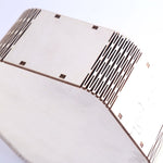 Close-up of a CD with a hexagonal design on a white background