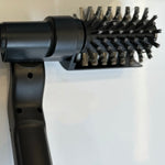 Black hair dryer brush attachment on a white background
