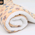 Rolled-up blanket with a floral pattern on a white background
