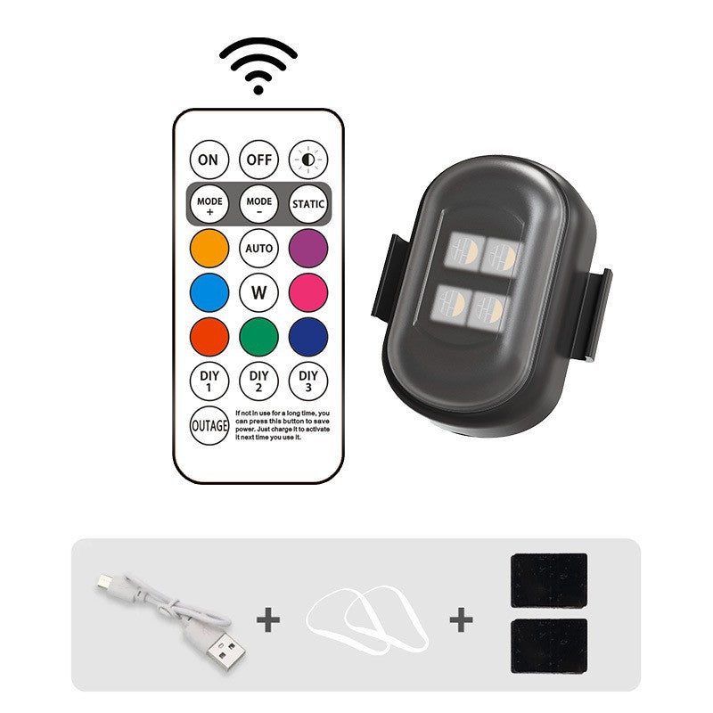 Remote control, light fixture, and USB cable on a white background