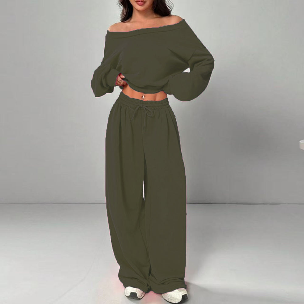 Green off-shoulder top and wide-leg pants set on a gray background