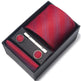 Red tie set with pocket square, cufflinks, and tie clip in a black box on a white background