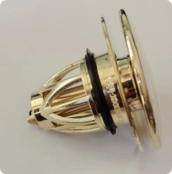Gold-colored mechanical component on a white background