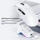 White gaming mouse with RGB magnetic charging base on a light gray background