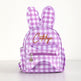 A small bunny-shaped backpack in a pink and white gingham pattern, featuring embroidered brown cursive text reading 'Catalya' on the front pocket, photographed against a clean white background.