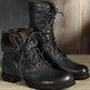 Pair of black leather boots with laces on a wooden surface. Men's & Women's Lace-Up Combat Boots | Mid-Calf Knight Boots & Black