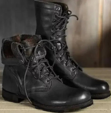 Pair of black leather boots with laces on a wooden surface. Men's & Women's Lace-Up Combat Boots | Mid-Calf Knight Boots & Black