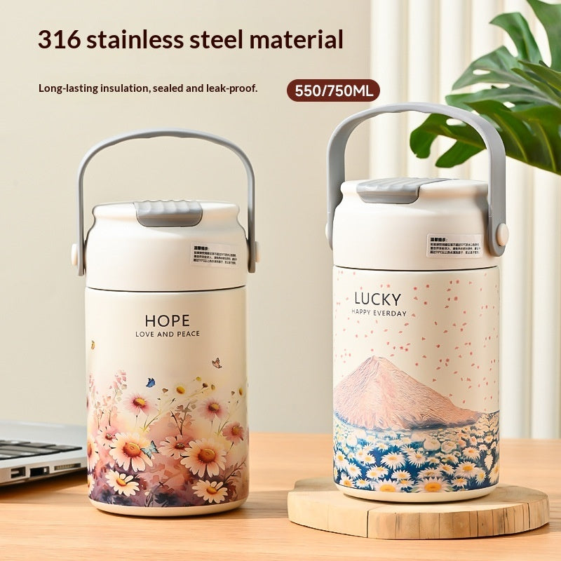 Two thermos bottles with floral and mountain designs on a wooden surface.