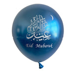 A metallic blue balloon with white Arabic calligraphy and the words 'Eid Mubarak' printed on it, shown against a plain white background.