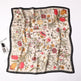 Floral patterned scarf on a white background with Celine branding.