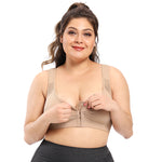 Woman wearing a beige compression garment on a white background