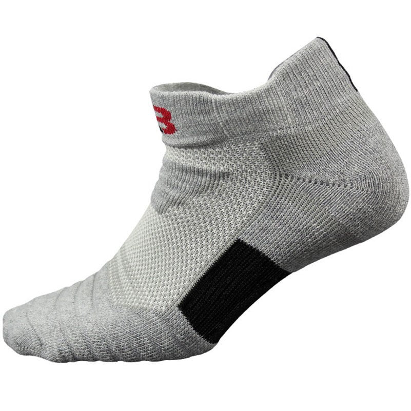 Gray ankle sock with a black patch and red logo on a white background