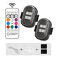 Two LED lights with a remote control on a white background