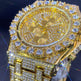 Gold watch with diamond accents on a dark background