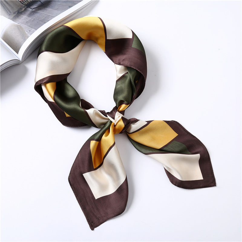 Colorful geometric patterned scarf on a white background