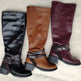 Three pairs of knee-high boots in black, brown, and burgundy with buckles on a light background.