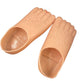 A pair of peach-colored silicone foot-shaped molds or molds for artificial nails, shown on a plain white background.