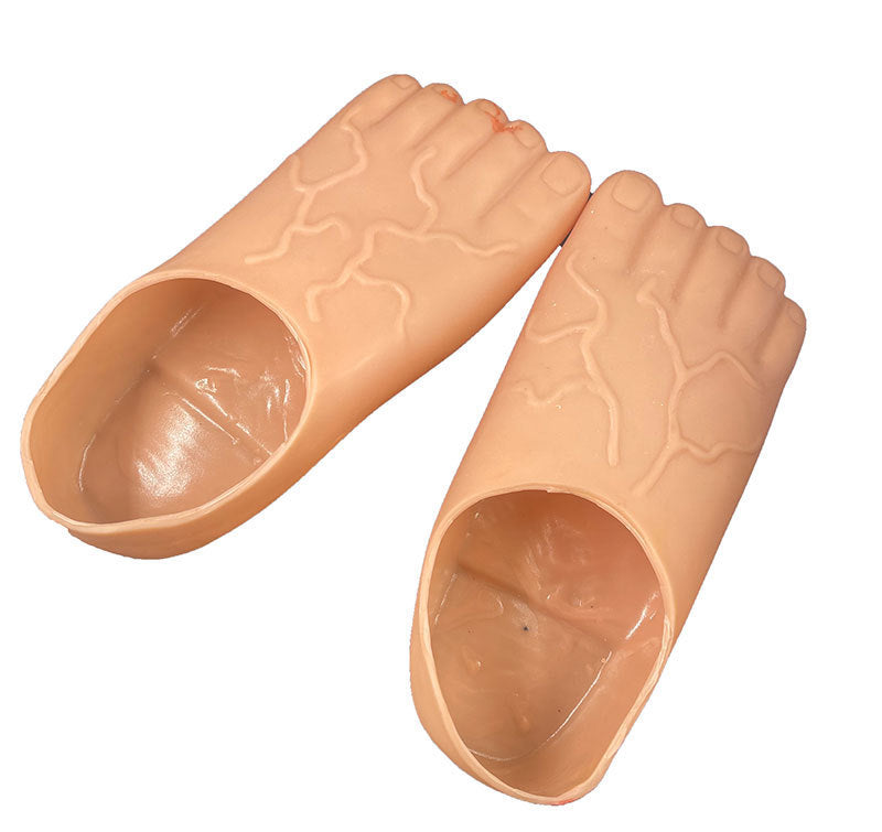 A pair of peach-colored silicone foot-shaped molds or molds for artificial nails, shown on a plain white background.