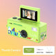 Green instant camera with colorful design on a gradient background